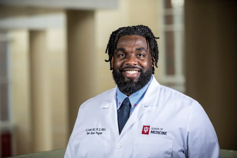 Russell Ledet in white coat
