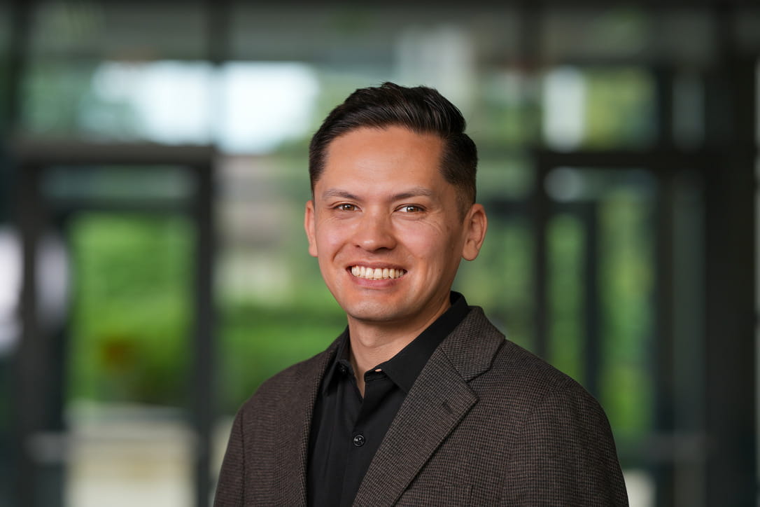 A man poses for a headshot photo