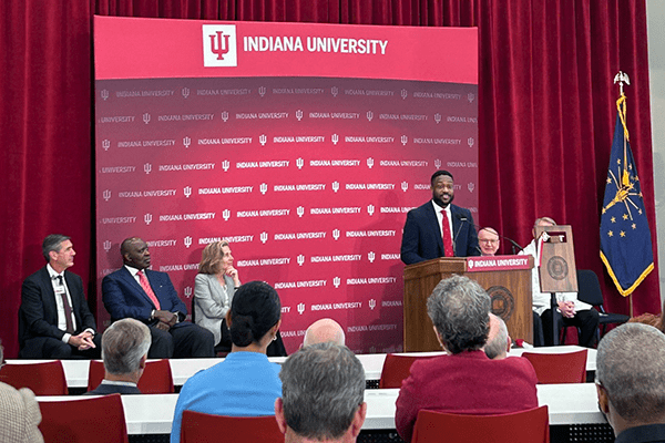 IU med student Myke Spencer speaks at a lectern at the MERB opening.