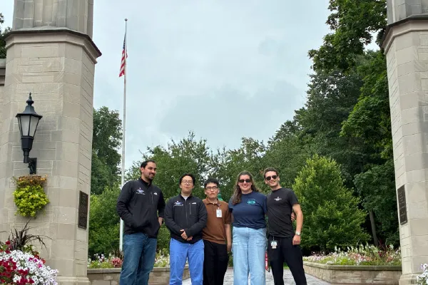 residents in bloomington wearing scrubs stand outside the sample gates