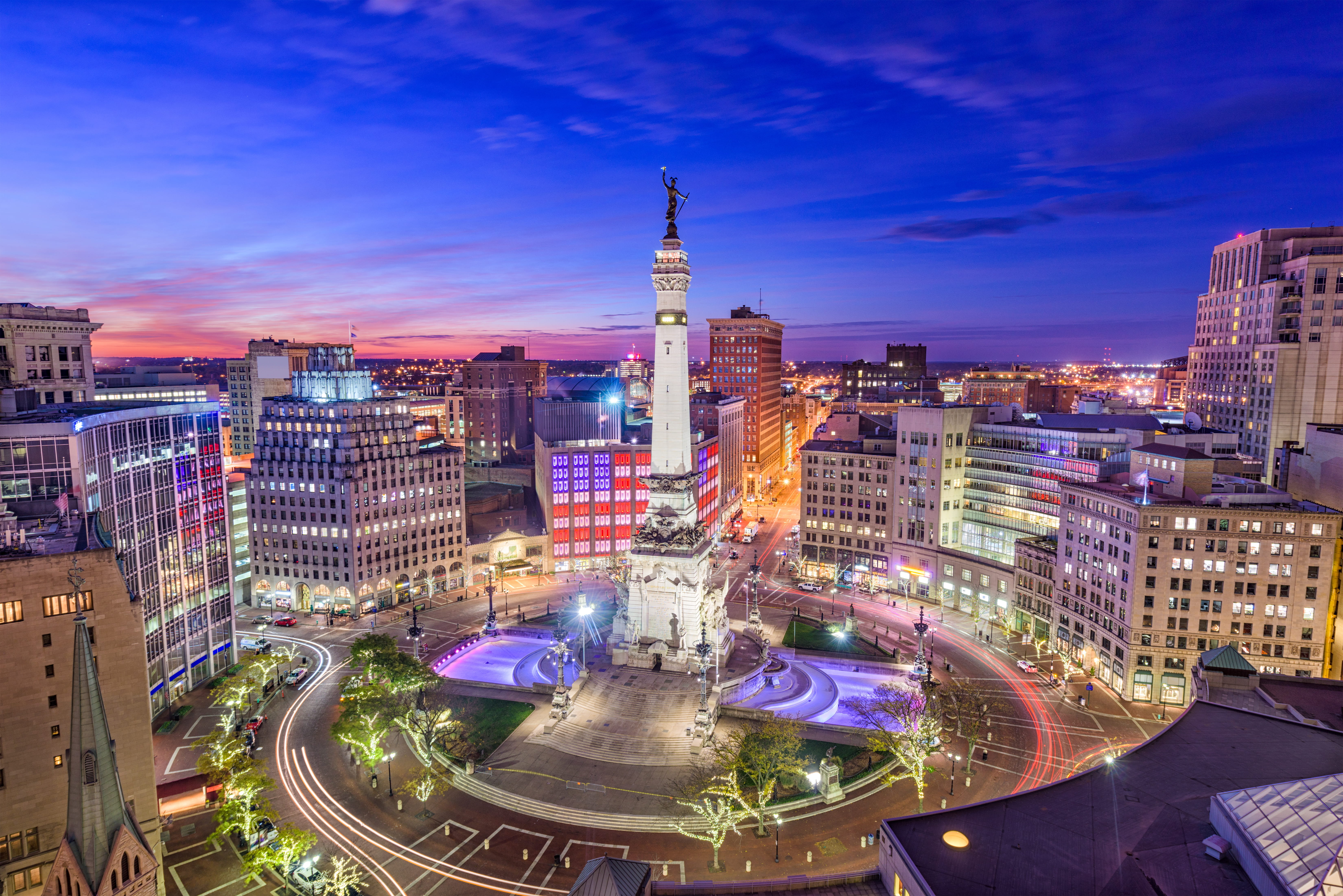 monument circle and indianapolis downtown at twilight