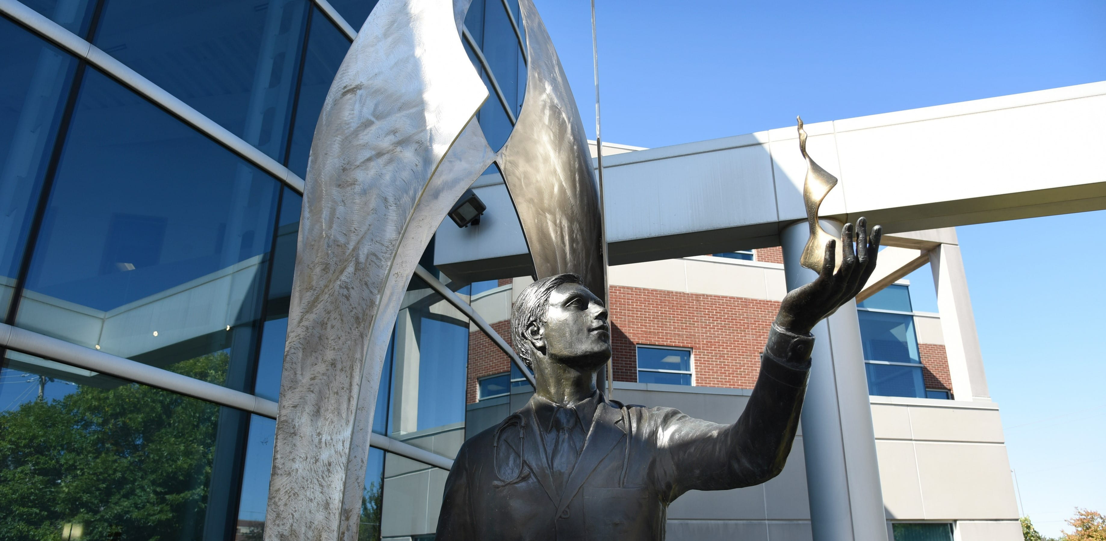 statue in front of muncie education building