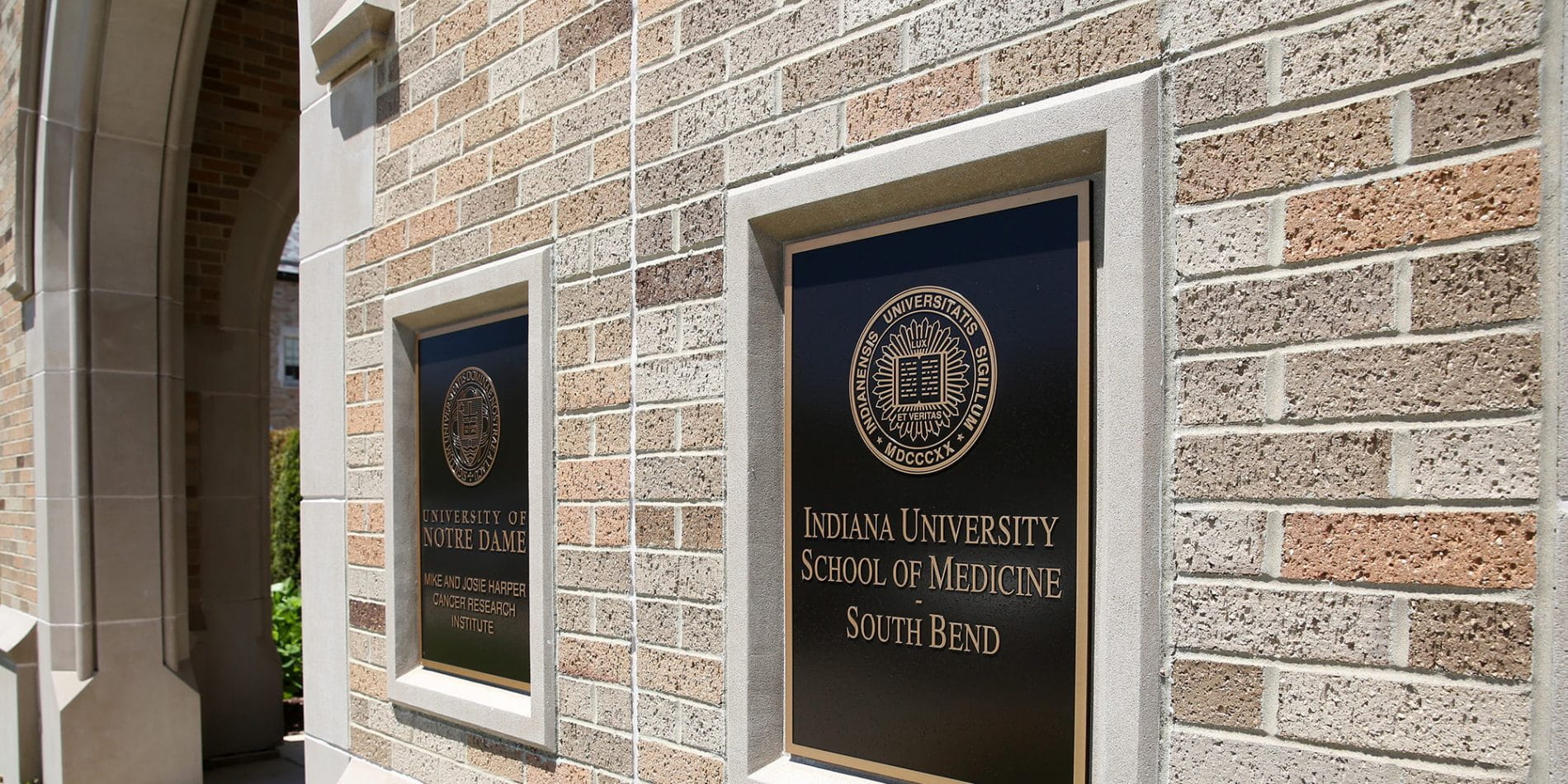 Exterior of building on the south bend campus with IU School of Medicine sign on the wall