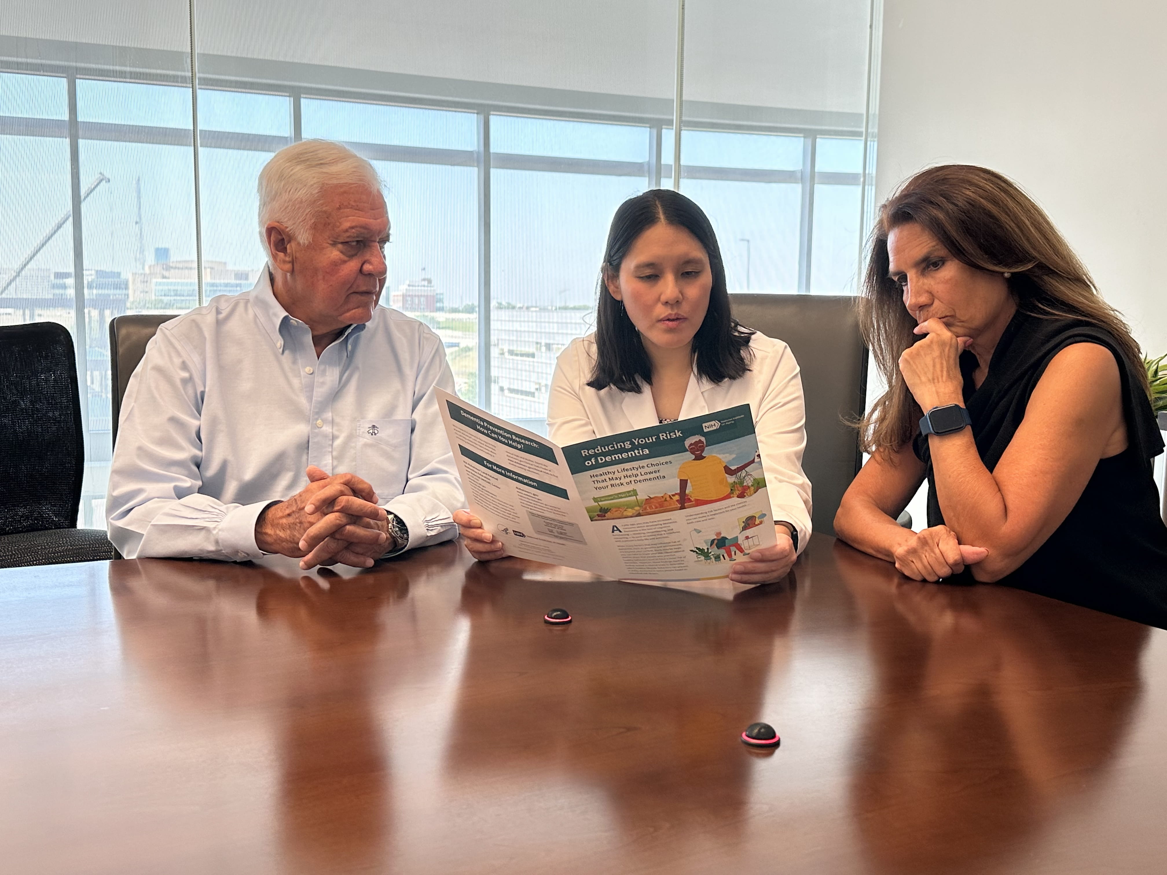 Dr. Dophia Wang speaks with research participants