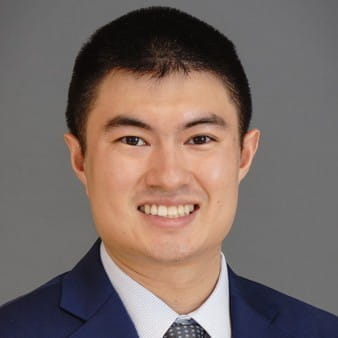 Professional headshot of Aaron Chum, MD, in a square shape.