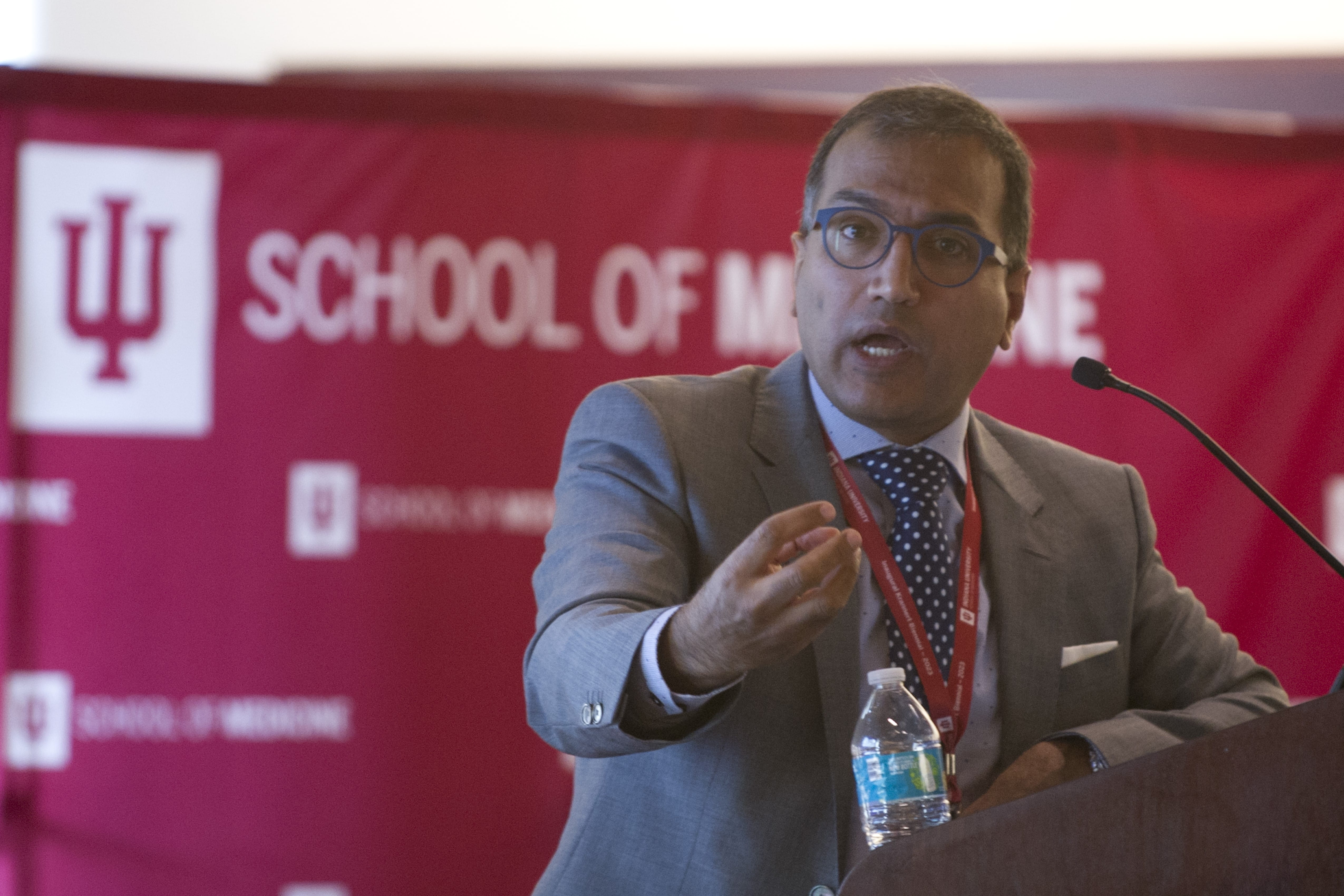 Andreas Kumar speaks at the podium