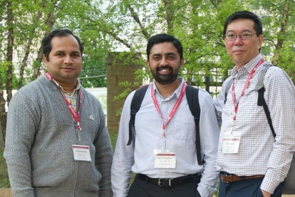 three researchers at the biennial reception
