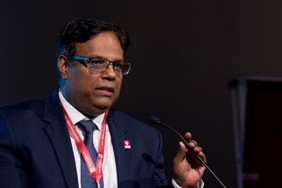 rohan dharmakumar speaks at the podium