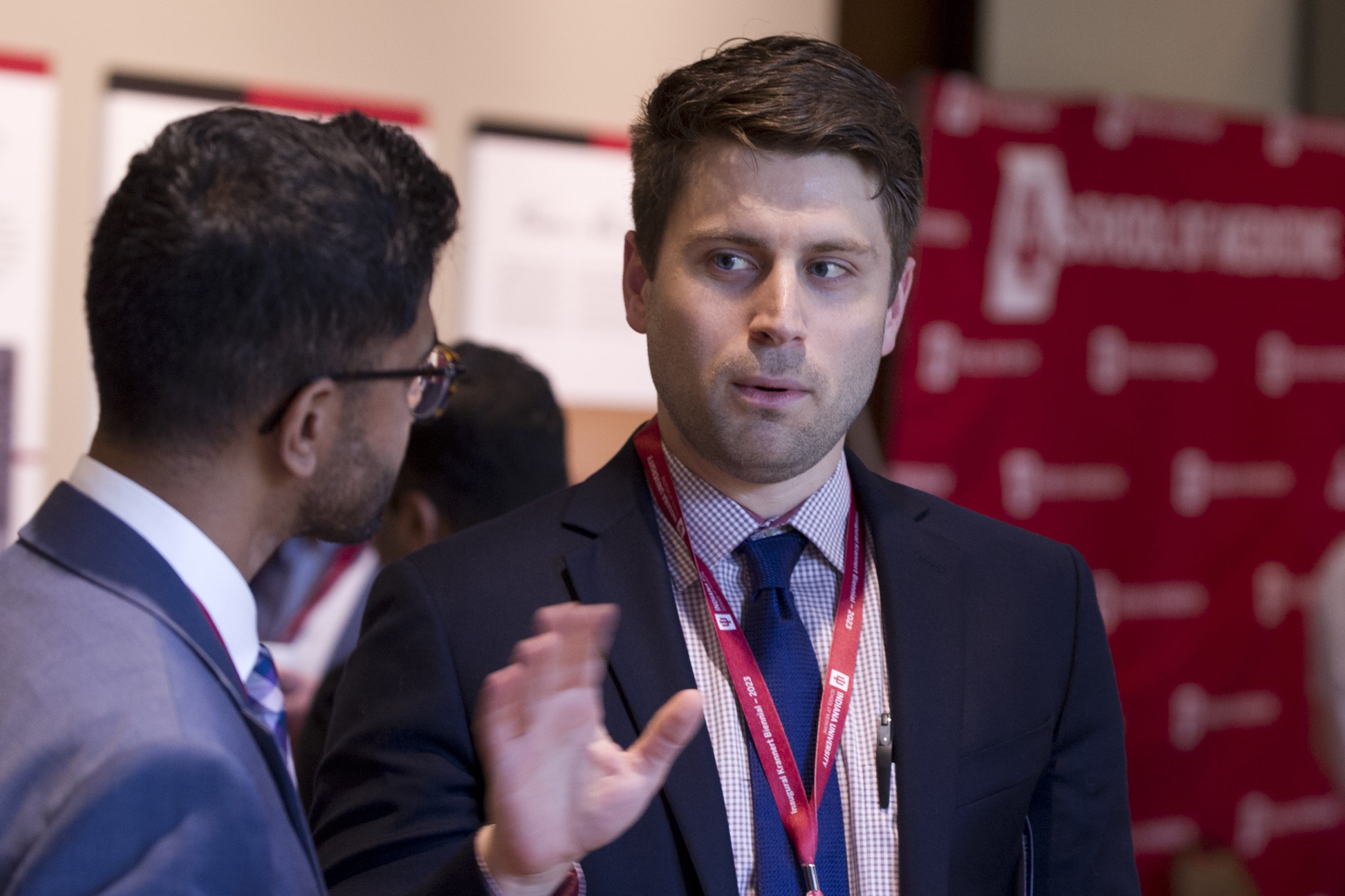 two residents chat during a break at the conference