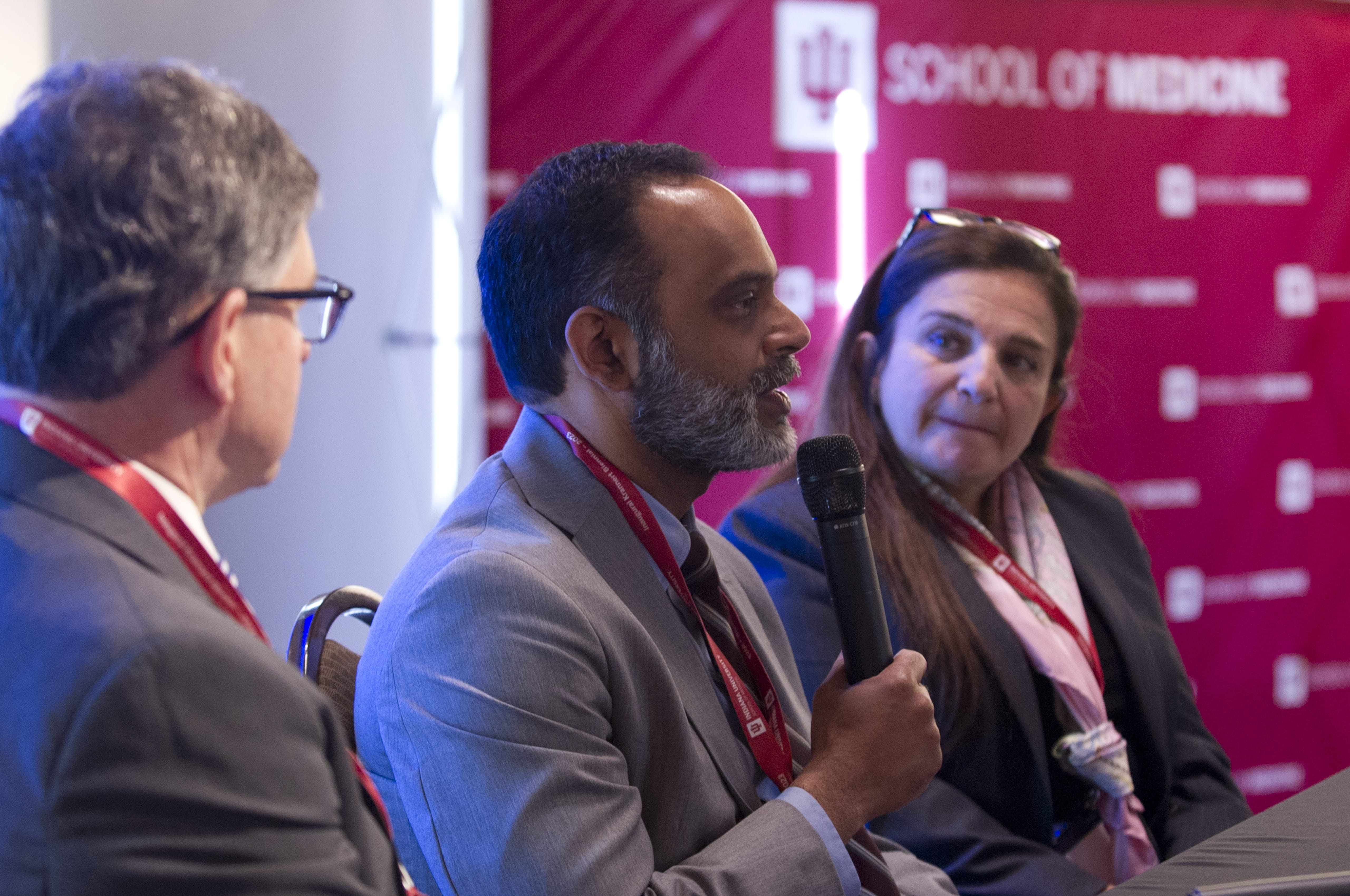 Edward Fry, MD, Sunil Rao, MD and Roxana Mehran, MD speak into a microphone