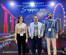 Dilek M. Yalcinkaya, MS, Behzad Sharif, PhD, and Hazar Benan Unal, MS, traveled to Singapore to present at the 2024 ISMRM & ISMRT Annual Meeting. Yalcinkaya and Unal are Purdue University doctoral candidates that are also IU Krannert research trainees. They are pictured in front of a conference poster backdrop with fireworks and a ferris wheel.
