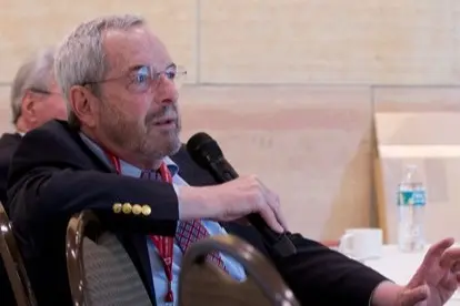robert kloner holds the microphone and asks a question