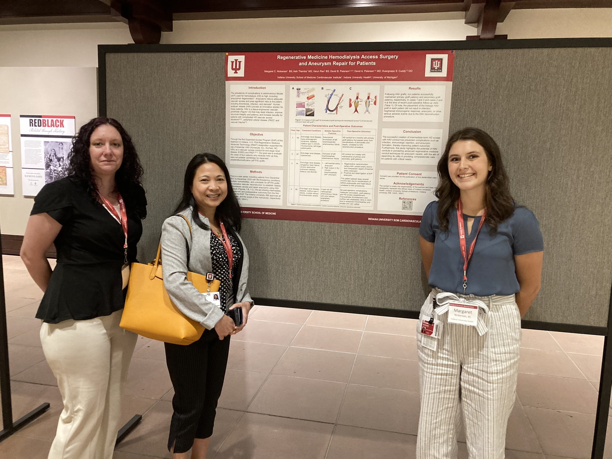 Early investigators stand in front of their research poster at the 2023 Krannert Biennial. 