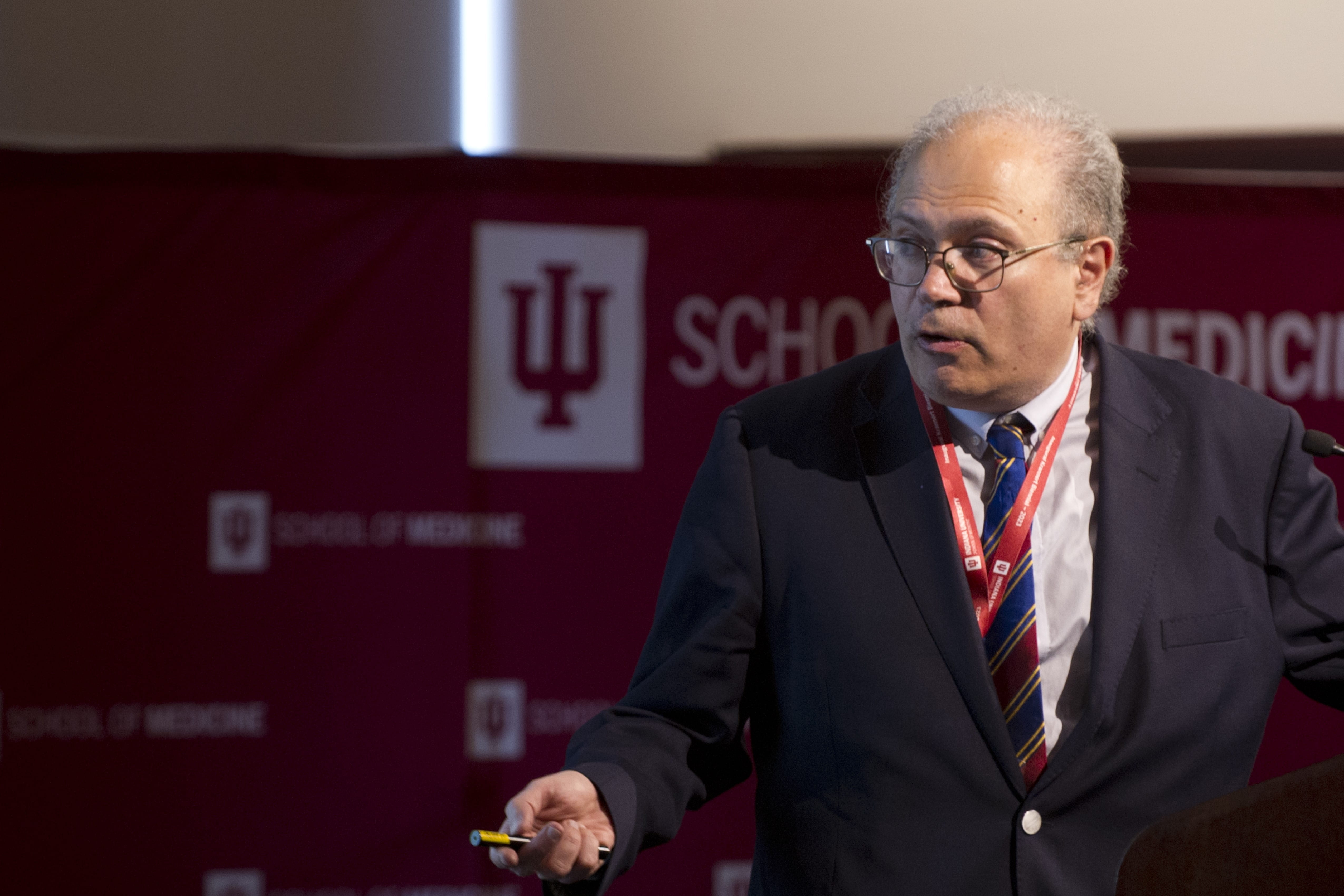 Nikolaos Frangogiannis speaks at the podium