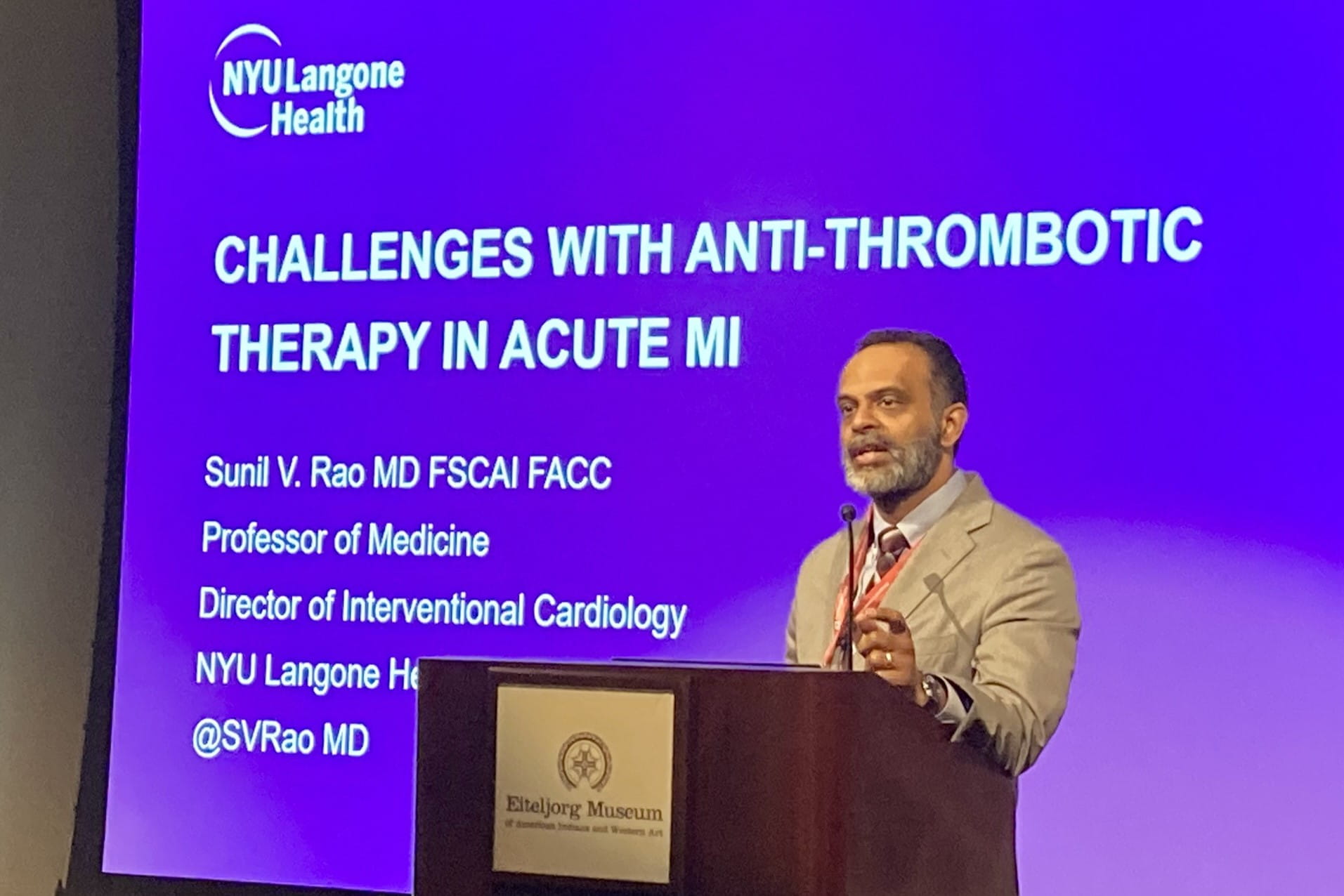 Sunil Rao speaks at the podium