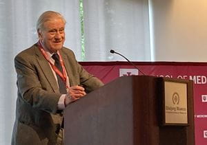 World-renowned cardiologist and researcher Valentin Fuster, MD, PhD, president of Mount Sinai Fuster Heart Hospital and physician-in-chief of The Mount Sinai Hospital, provided the special lecture, "Progression of Arterial Disease Throughout the Lifespan." Valentin Fuster speaks at a podium with a microphone. He is wearing a tan suit and has gray hair.