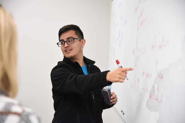 a student in evansville talking through a problem in class