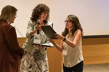 CDMD member being presented with an award at the CDMD sympsoium