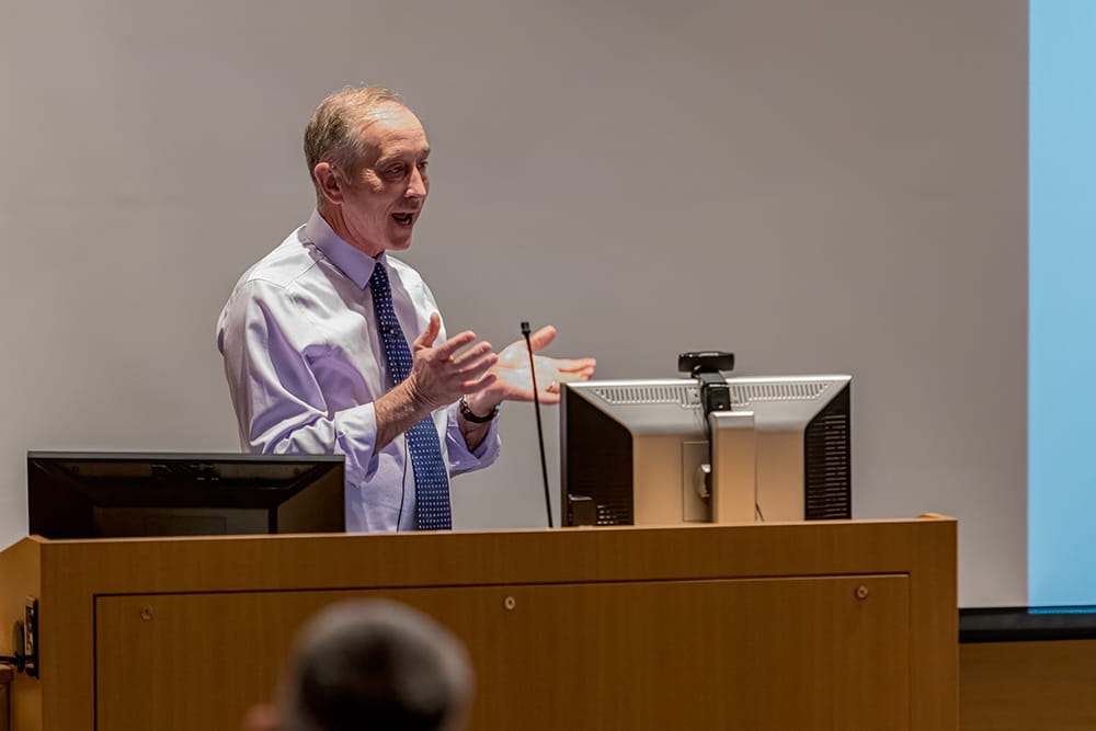 Dr. Robert Considine delivering a presentation.