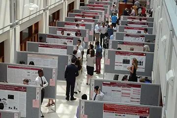 High up view of poster session with attendees at the annual CDMD Symposium