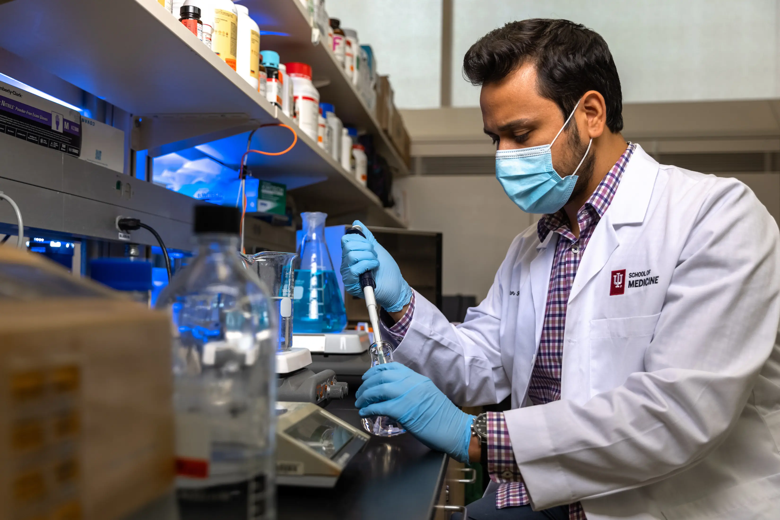 A male scientist experiments with radioactive material.
