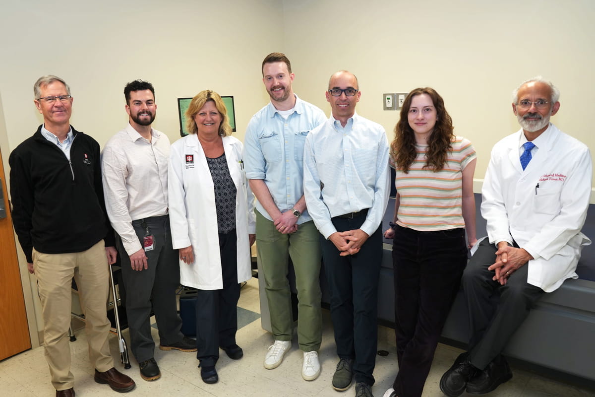 members of the clinical research team stand together in the clinic space