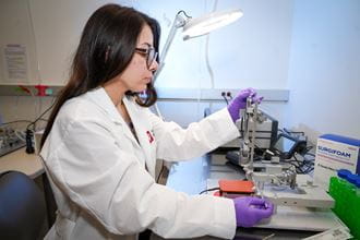 a researcher works in a lab