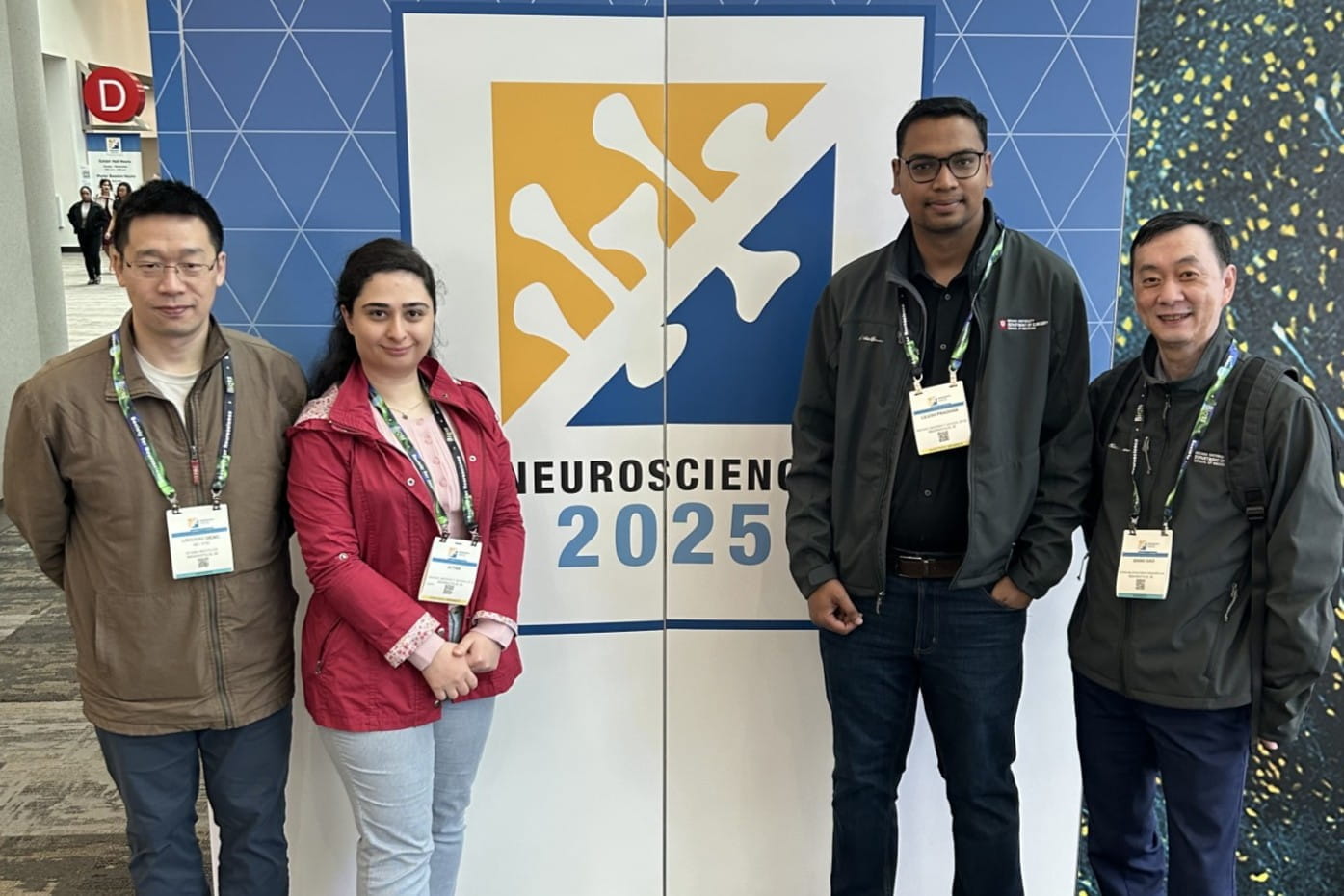 a group of scientists pose at a neuroscience conference