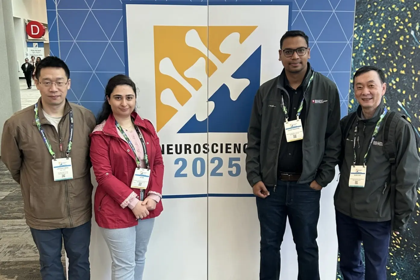 a group of scientists pose at a neuroscience conference