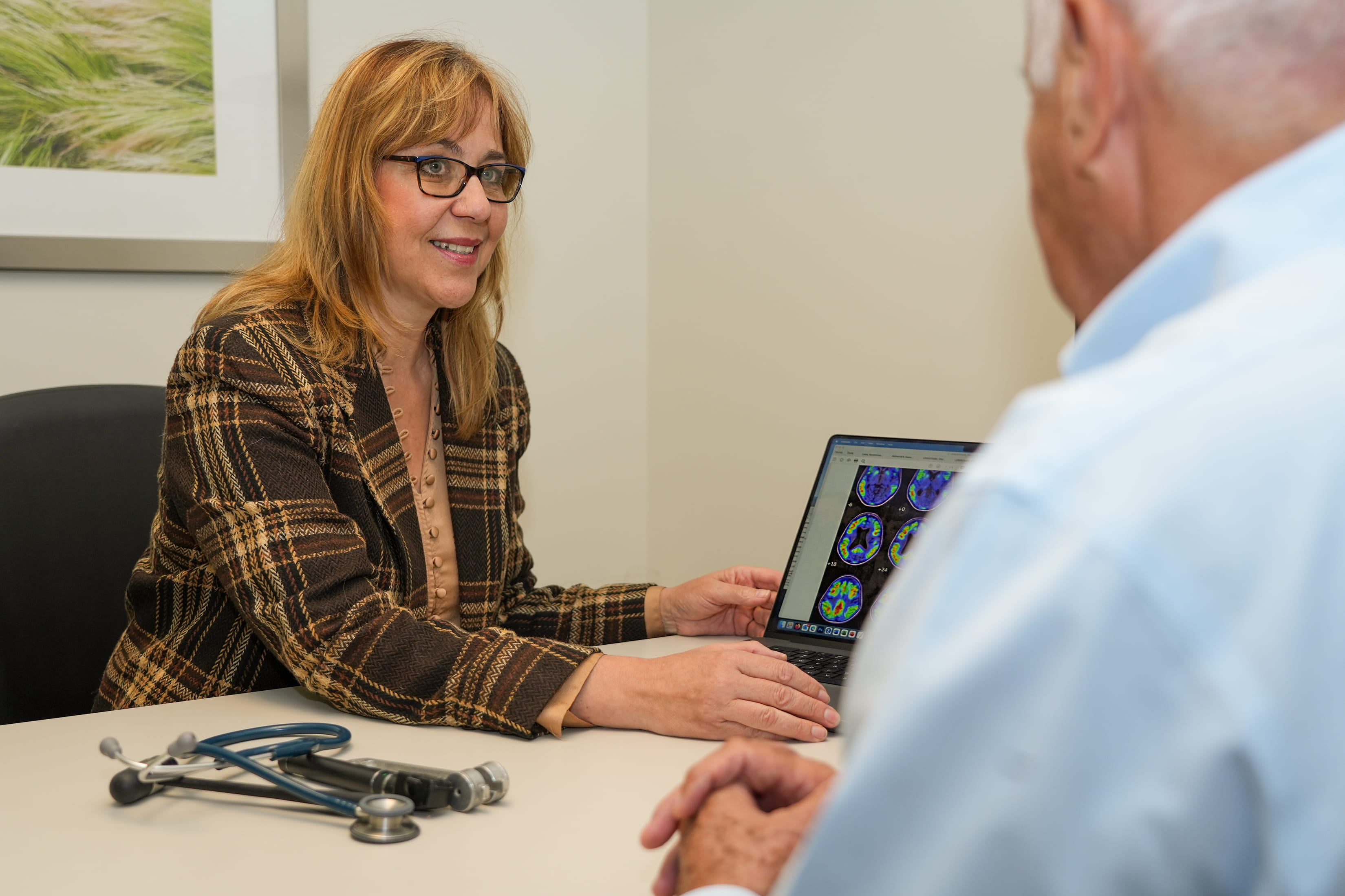 a clinician meets with a clinical trial participant