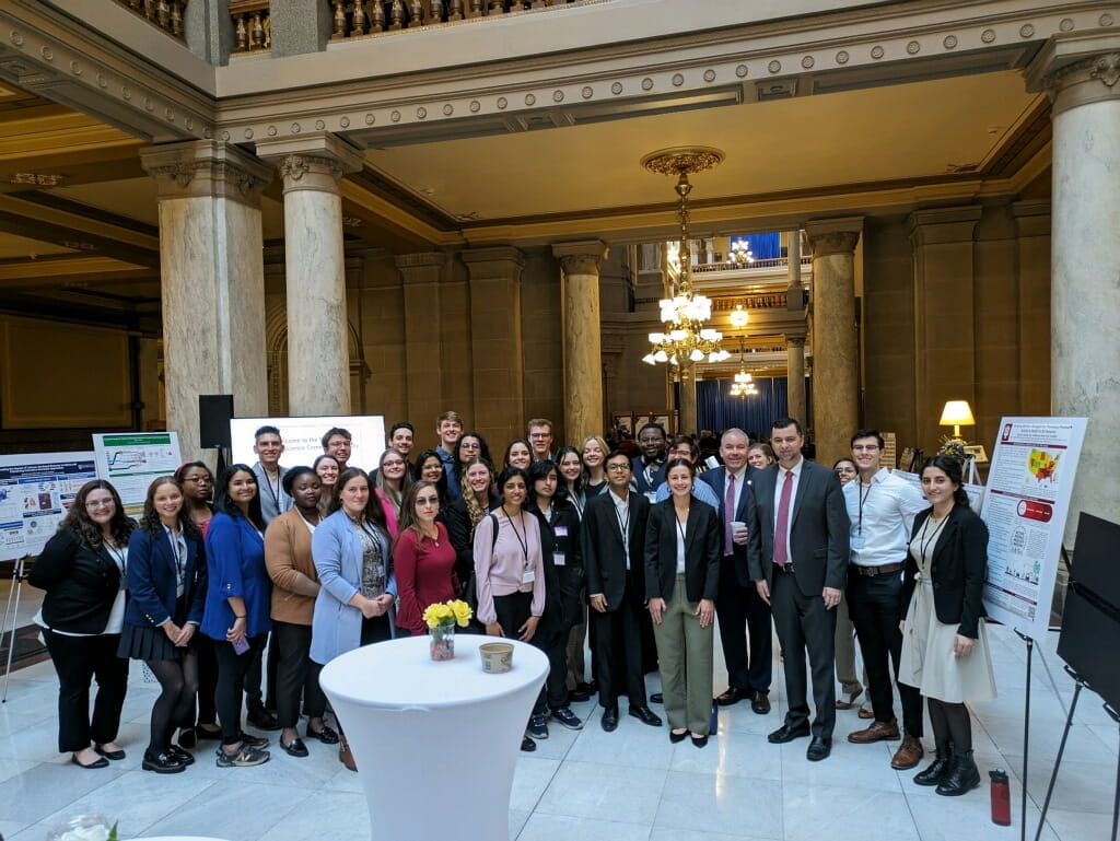 group photo of scientists and lawmakers