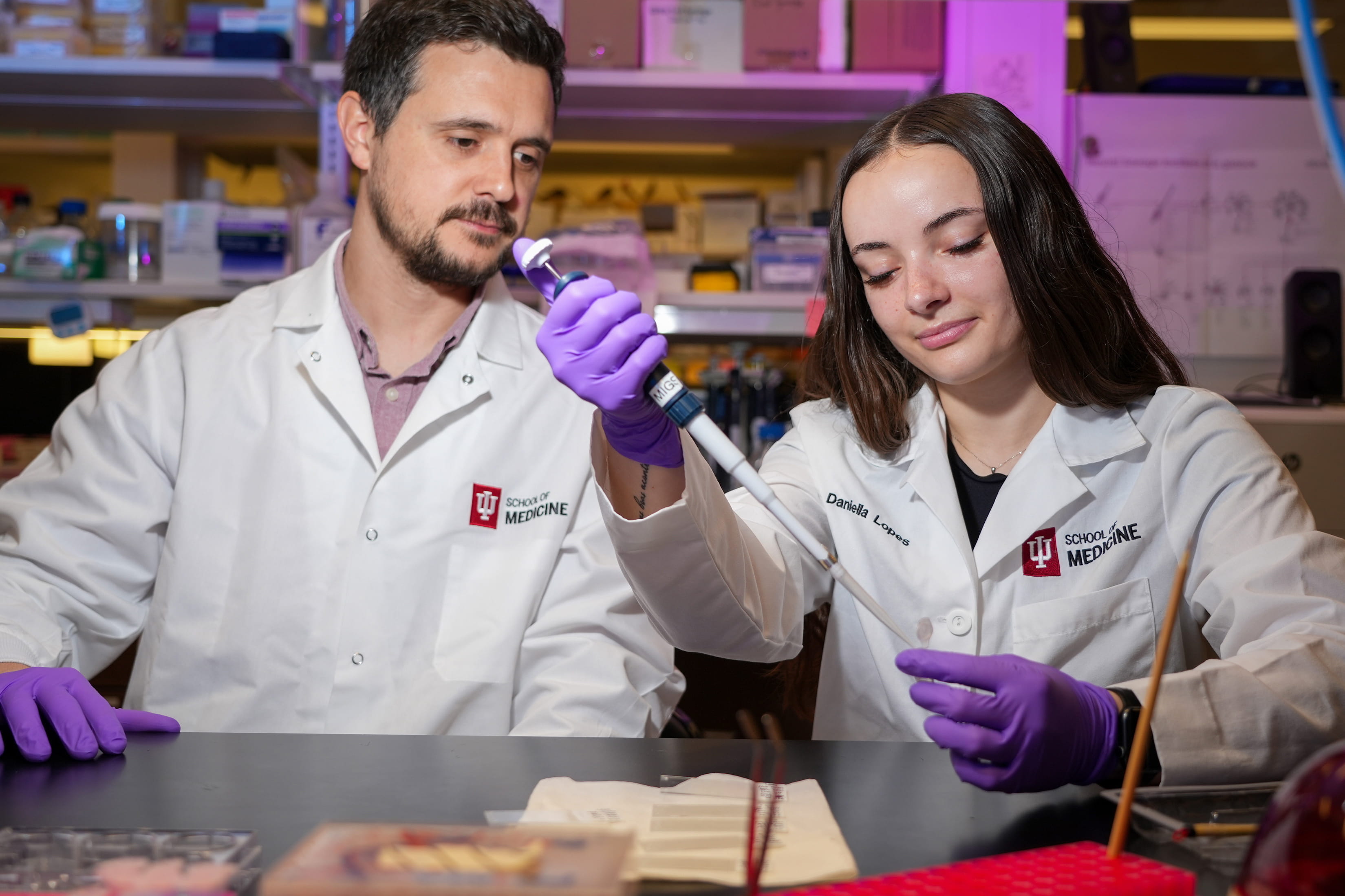 a PhD student works in a lab