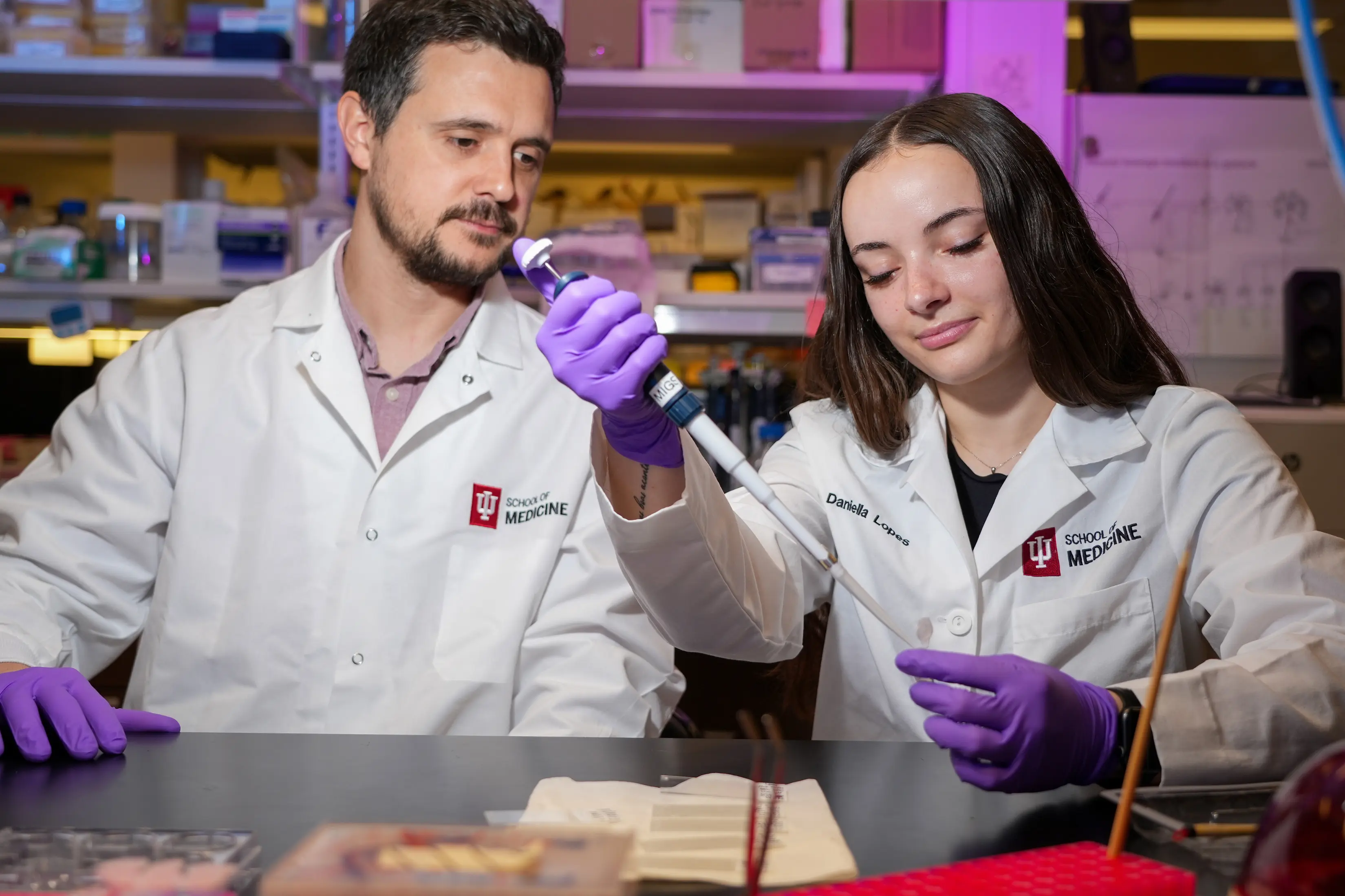 a PhD student works in a lab