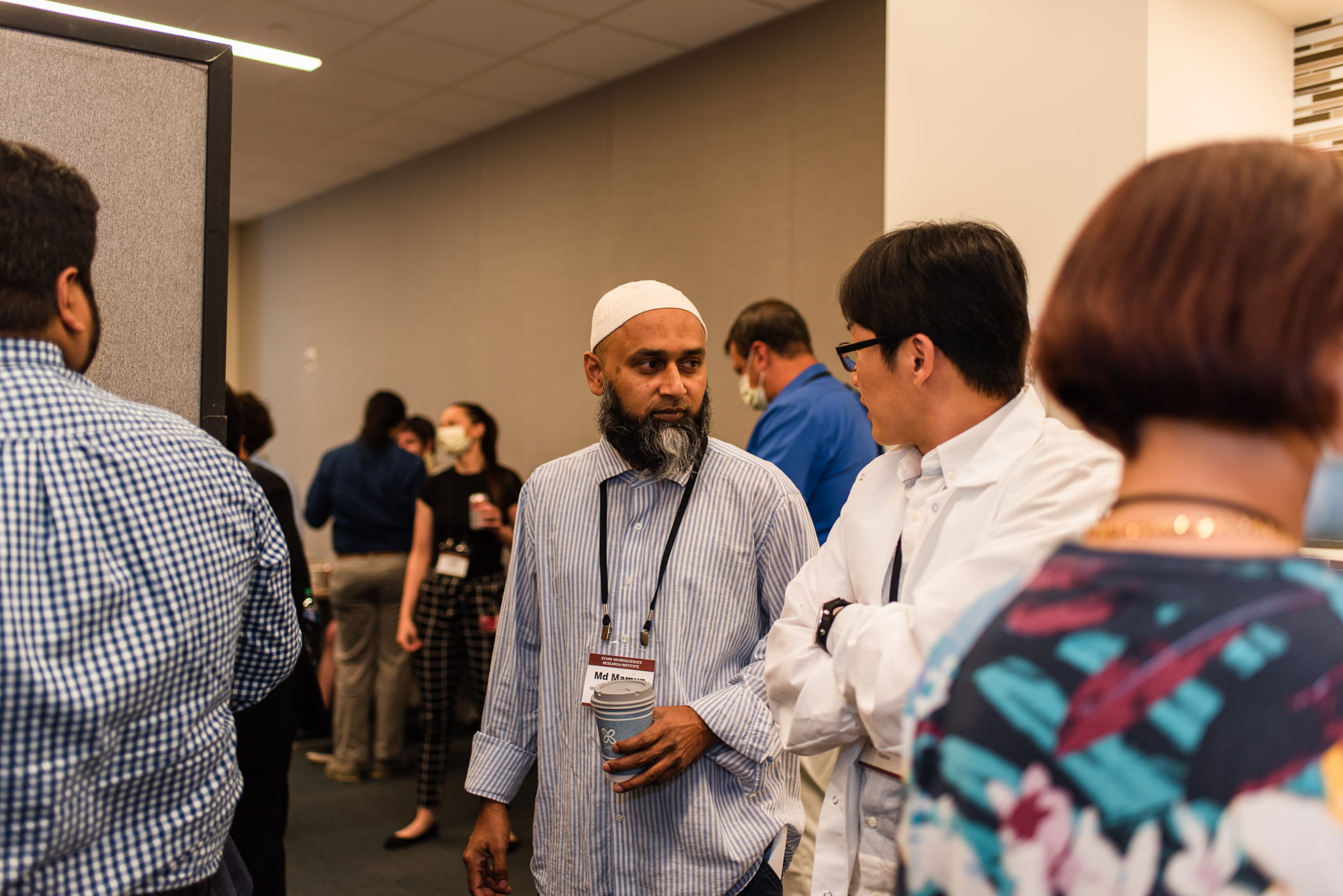 two people talk at a reception