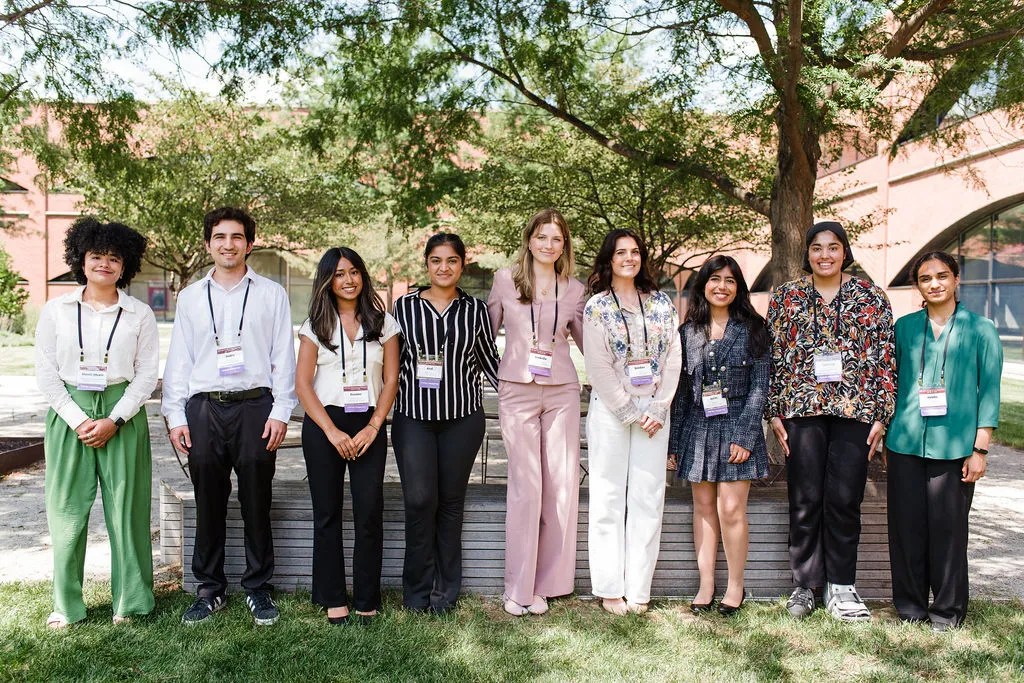 a group of students pose outside