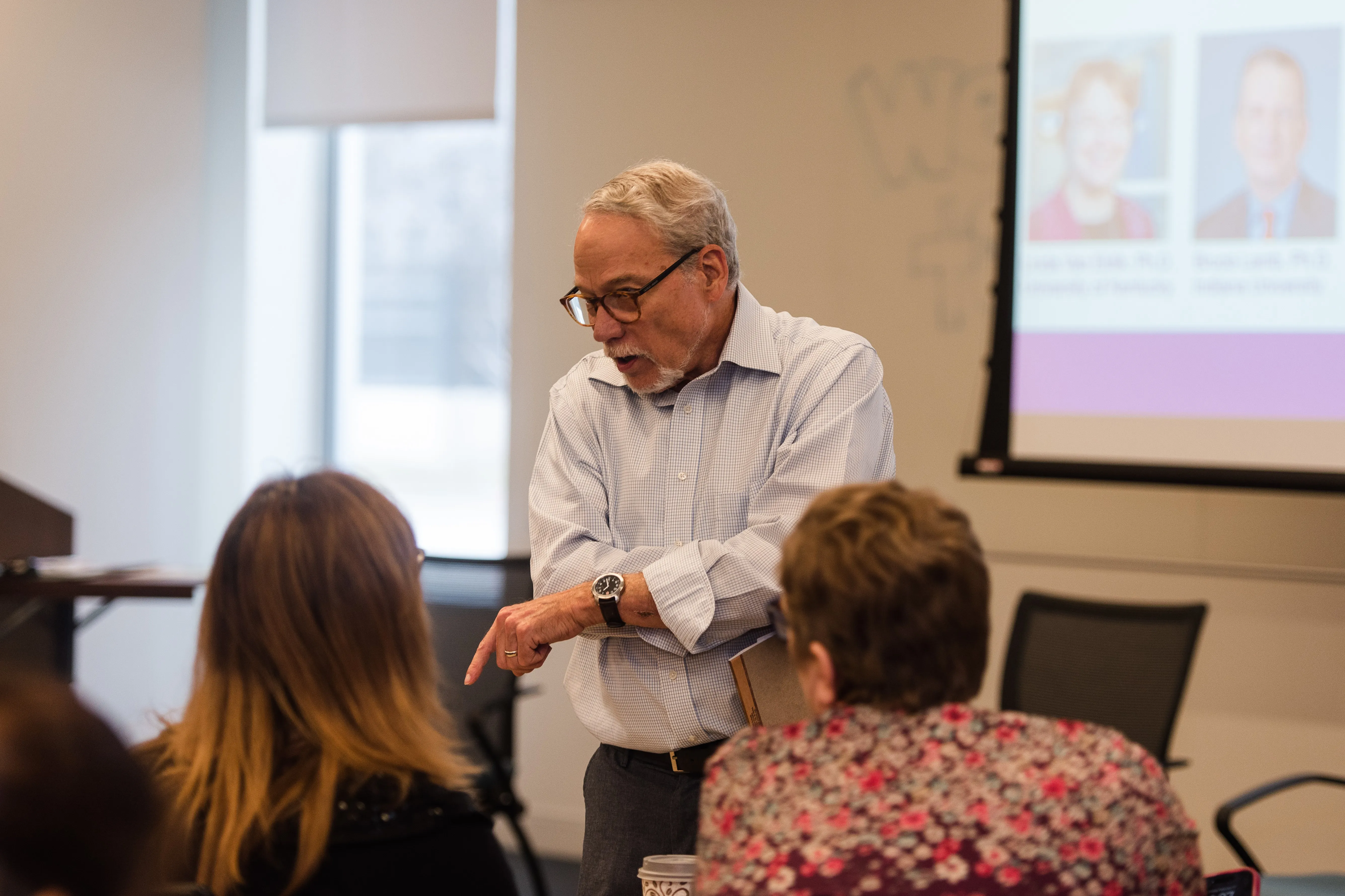 Gary Landreth speaks to event attendees in a room