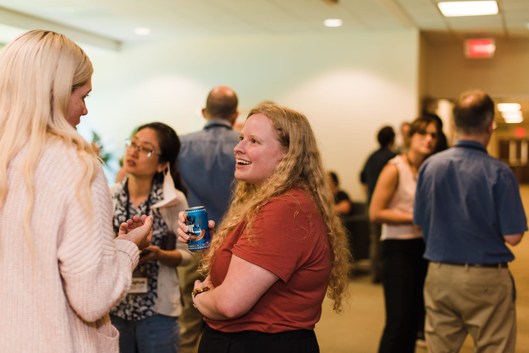 two people talk at a reception