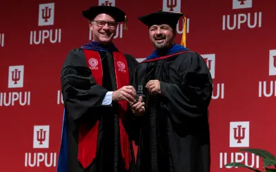 Dr. Reuben Kapur and IUPUI Interim Chancellor Klein at the 2023 IUPUI Chancellor's Academic Honors Convocation.