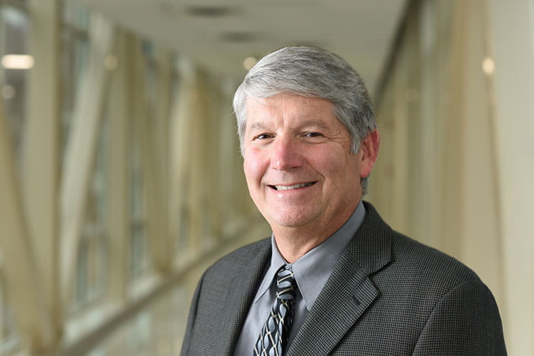 A portrait of a smiling man.