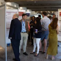 Candid photo of IU researchers at ICAN 2023 event
