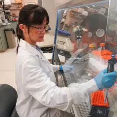 Kate Ho, PhD, working in the lab