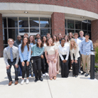 Group photo of the 2025 interns outside of the Wells Center's main research building.