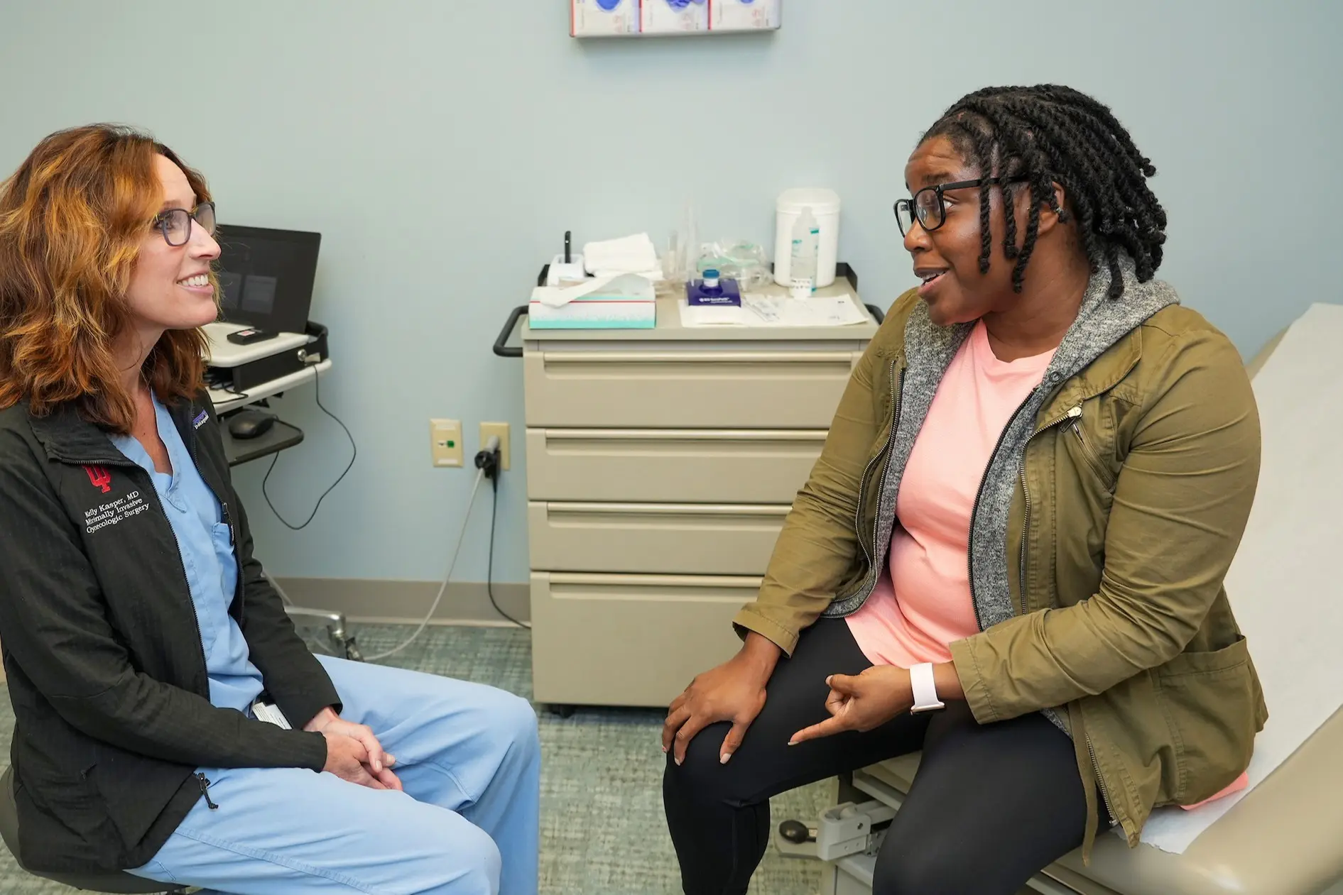a patient speaks to Kelly Kasper in the clinic