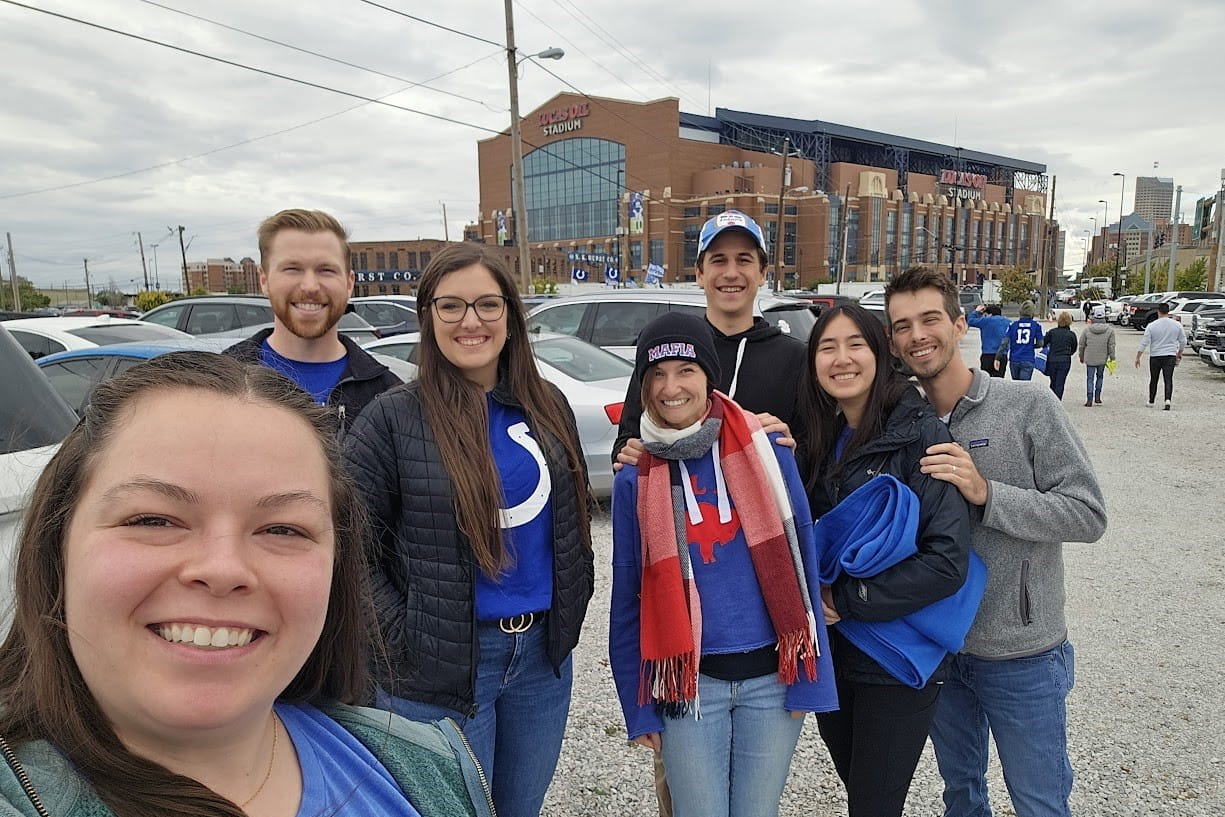Residents outside on a fall day in front of the colts' football stadium