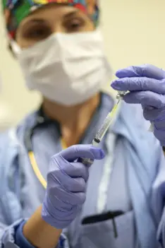 physician in scrubs in OR