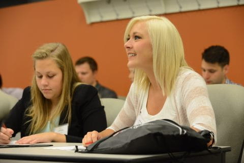 Students take notes in class.