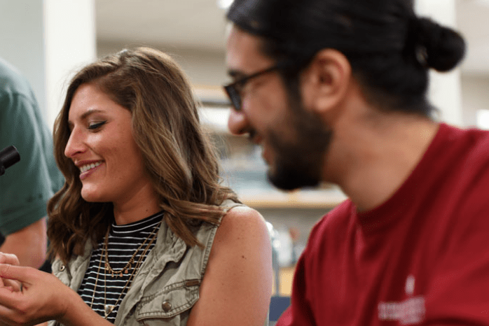 two toxicology students work together in the lab