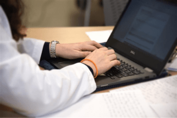 Person typing on a laptop