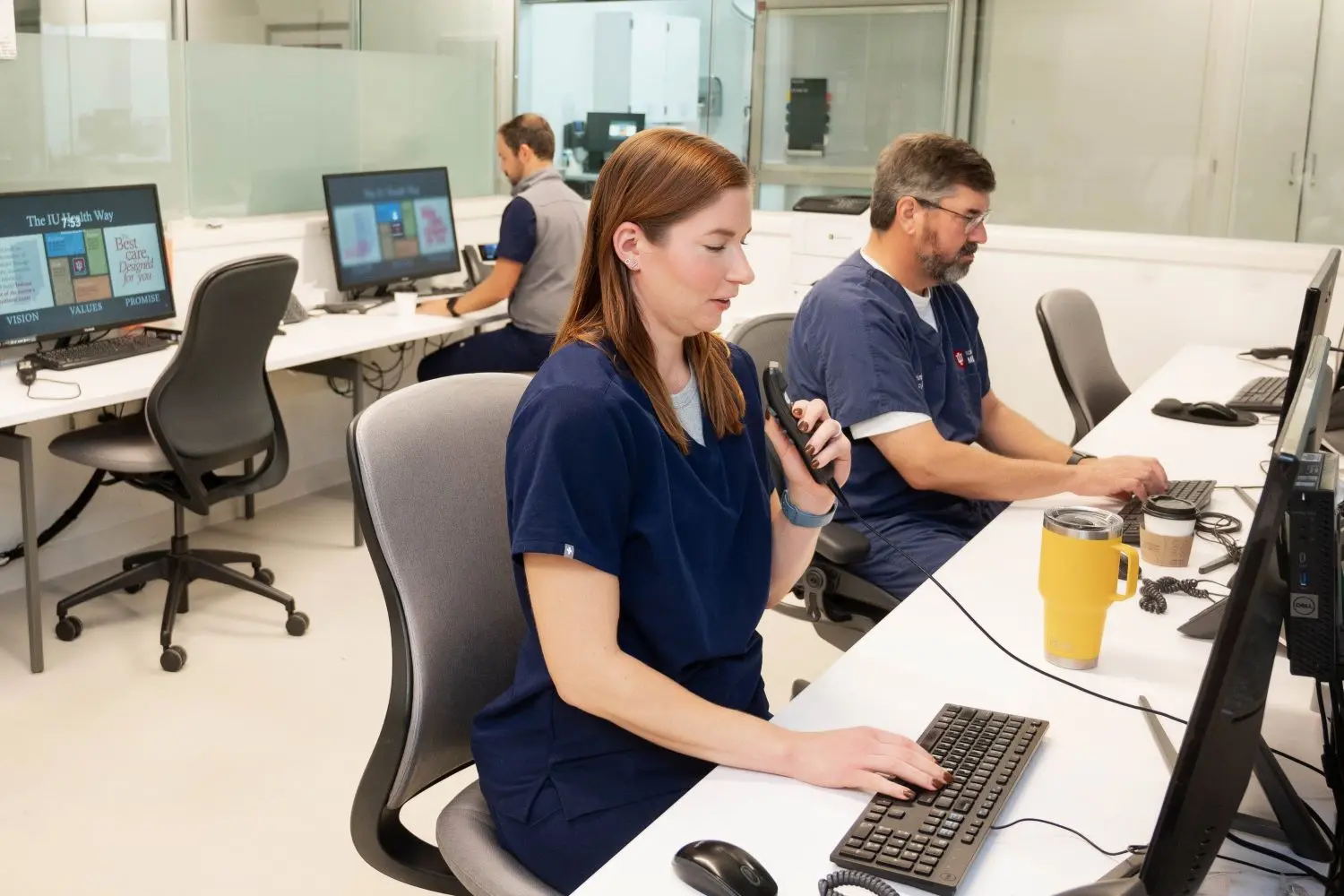 Faculty work at the computers in the emergency department. 