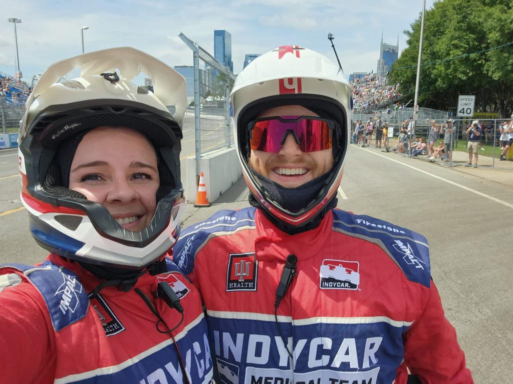 Drs. Julia Vaizer and Leonard Edwards post for a selfie on the race track.